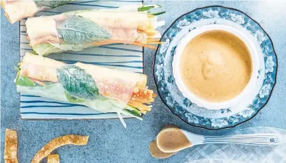  ?? RICARDO ?? A salty peanut sauce tops off this 12-roll recipe, which uses julienned cucumber, carrot and pickled kohlrabi.