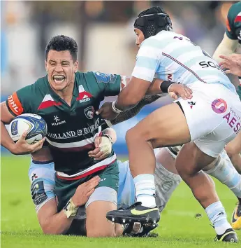  ??  ?? Leicester’s Matt Toomua is tackled by Henry Chavancy and Anthony Tuitavake of Racing 92 at Stade Yves-Du-Manoir yesterday