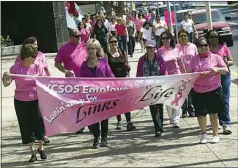  ?? CALIFORNIA­N FILE PHOTO ?? Employees of the Kern County Superinten­dent of Schools walk along Truxtun Avenue with others at the Links for Life “Lace’n it Up” walk in 2014. Registrati­on is open for this year’s event, which will take place in a virtual format.
their alma mater.