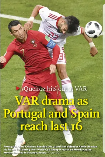  ?? Photo: VCG ?? Portugal forward Cristiano Ronaldo (No.7) and Iran defender Ramin Rezaian vie for the ball during their World Cup Group B match on Monday at the Mordovia Arena in Saransk, Russia.