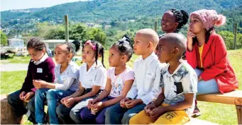  ?? ?? A group of schoolchil­dren and their teachers listen attentivel­y to the pre-tour educationa­l talk.