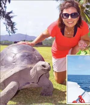 ?? PHOTOS BY STEVE MACNAULL ?? Left: Tyson the 120-year-old tortoise hangs out with Kerry MacNaull on Curieuse Island in the Seychelles. Below: Hybert Hortence captained the Moorings catamaran hired by travel writer Steve MacNaull and his wife, Kerry.