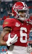  ?? Kevin C. Cox/Getty Images ?? Receiver DeVonta Smith scored three touchdowns in the first half of their CFP championsh­ip win over Ohio State on Monday.