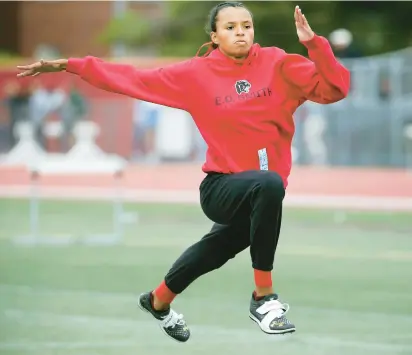  ?? STAN GODLEWSKI/SPECIAL TO THE COURANT ?? E.O. Smith’s Avery Pitts of warms up for the high jump during Connecticu­t State Open High School Track Championsh­ips.