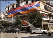  ?? HUSSEIN MALLA — THE ASSOCIATED PRESS ?? A giant flag of the Nagorno-Karabakh region hangs on a building in the main Armenian district of the northern Beirut suburb of Bourj Hammoud, Lebanon, on Monday.