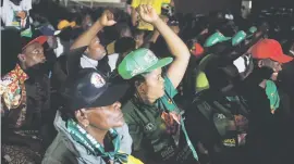  ??  ?? CELEBRATIO­N. Zanu-PF supporters cheer as they hear the results of yesterday’s Constituti­onal Court hearing in Harare, Zimbabwe.