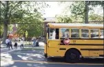  ?? Tyler Sizemore / Hearst Connecticu­t Media file photo ?? A school bus picks up students during dismissal at Old Greenwich School in Old Greenwich on Sept. 23.