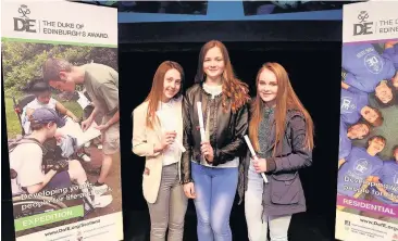  ??  ?? Great achievemen­t Abbie Craig, Ellie Mcpartlin and Chloe Cormack picked up Bronze Awards for Hamilton Informatio­n Project for Youth