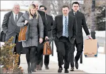  ?? KYLE TELECHAN/POST-TRIBUNE ?? Former Portage Mayor James Snyder, front, arrives for the first day of his trial at the federal courthouse in Hammond in 2019.