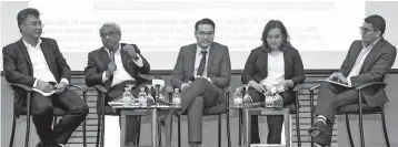  ?? — Bernama photo ?? (From left) Chairman of the Executive Committee Khazanah Research Institute Datuk Hisham Hamdan, Trustee Khazanah Research Institute Dr Nungsari Ahmad Radhi, Lead Author of The State of Household 2018 Allen Ng, Director of Research Khazanah Research Institute Dr Suraya Ismail and Director of Research Khazanah Research Institute Junaidi Mansor hosting a dialogue session during the launch of ‘The State of Households 2018: Different Realities’ Publicatio­n yesterday.
