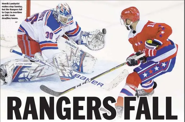  ?? AP ?? Henrik Lundqvist makes stop Sunday, but the Rangers fall to Caps in overtime as NHL trade deadline looms.