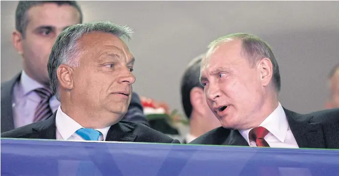  ??  ?? EASTERN FRONT: Russian President Vladimir Putin, right, talks with Hungarian Prime Minister Viktor Orban, a fellow nationalis­t leader whose brand of populism ultimately benefits the state.
