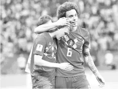  ??  ?? Belgium’s midfielder Kevin De Bruyne (L) and Belgium’s midfielder Axel Witsel celebrate after the Russia 2018 World Cup quarter-final football match between Brazil and Belgium at the Kazan Arena in Kazan on July 6, 2018. Belgium beat World Cup...