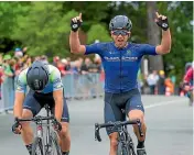  ??  ?? Aaron Gate celebrates after making a perfect start at the New Zealand Cycle Classic yesterday.