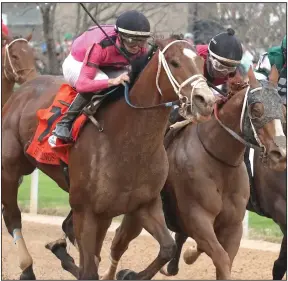  ?? (The Sentinel-Record/Richard Rasmussen) ?? Jockey Florent Geroux (left) rides C Z Rocket past jockey Ricardo Santana and Whitmore to win the Hot Springs Stakes on Saturday at Oaklawn.