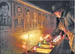  ?? REUTERS ?? DISASTER ANNIVERSAR­Y: A woman lights a candle at a memorial to firefighte­rs and workers who died after the Chernobyl nuclear disaster 36 years ago, in Slavutych, Ukraine. Russia’s takeover of the Chernobyl site was “very dangerous” , Rafael Grossi, head of the UN atomic watchdog said.