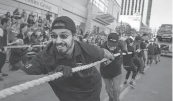  ?? DAX MELMER ?? Louis Moro leads his team from Laval during the Ram Tough Truck Pull for United Way Windsor and Essex County in downtown Windsor on Sunday.