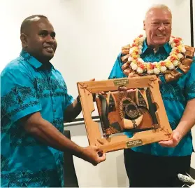  ?? ?? Grassroots Developmen­t manager Malakai Yamaivava left presenting a token of appreciati­on to Bumble Bee general manager Operations Brett Carter at the Holiday Inn; Suva on January 5,2023.