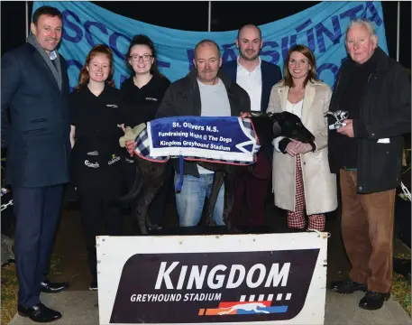  ??  ?? Noel O’Leary receiving the cup from Eileen and Bill Sheahan after Noel’s dog, Loher Grove, won the Wallis Arms Hotel Confined Final at the Kingdom Greyhound Stadium. Also picture is Rory Dahl, Tom Megan and Keily Horgan. Photo by David O’Sullivan