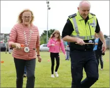  ??  ?? Mayor Rosaleen O’Grady taking part in the egg and spoon race