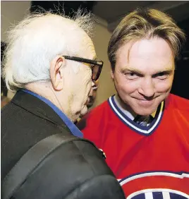  ?? JOHN MAHONEY/FILE ?? Red Fisher chats with Patrick Roy in 2008, following the announceme­nt that the Canadiens would be retiring the goaltender’s No. 33 sweater. Fisher maintained the trust of players over the years by always being fair, with a steadfast refusal to report...