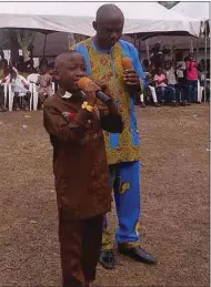  ?? ?? Kid preacher, Samuel with an interprete­r