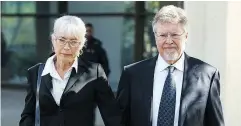  ?? IAN KUCERAK / POSTMEDIA NEWS FILES ?? Gayska and Richard Suter, right, leave court in 2015. Richard Suter was attacked by vigilantes after a crash that killed a two-year-old boy.