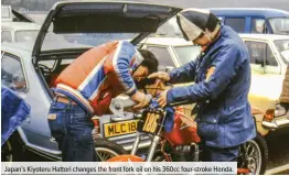  ??  ?? Japan’s Kiyoteru Hattori changes the front fork oil on his 360cc four-stroke Honda.