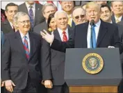  ?? Saul Loeb AFP/Getty Images ?? THE CENTERPIEC­E of the Republican tax law was a reduction in the corporate rate to 21% from 35%.