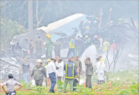  ?? — AFP photo ?? Picture taken at the scene of the accident after a Cubana de Aviacion aircraft crashed after taking off from Havana’s Jose Marti airport.