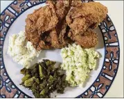  ?? BOB TOWNSEND FOR THE ATLANTA JOURNAL-CONSTITUTI­ON ?? Johnny’s four-piece fried chicken combo comes with a breast, wing, leg and thigh, and a choice of sides.