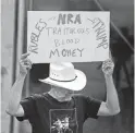  ?? Ronald Cortes / Contributo­r ?? Andrew Morosky listens to the speakers as the rally begins its march Saturday.