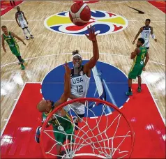  ?? LINTAO ZHANG / GETTY IMAGES ?? Myles Turner of Team USA drives to the rim against Didi Louzada of Brazil during their Group K match in the FIBA World Cup on Monday at Shenzhen Bay Sports Centre in Shenzhen, China.