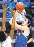  ?? AJ MAST AP ?? UCLA guard Jaime Jaquez Jr., who scored 17 points, shoots over Alabama forward Herbert Jones.