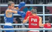  ?? PTI ?? Amit Panghal (in blue) in action during the 49kg semifinal.