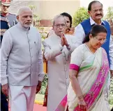  ?? — PTI ?? President Pranab Mukherjee greets MPs as he walks along with Prime Minister Narendra Modi, Lok Sabha Speaker Sumitra Mahajan and parliament­ary affairs minister M. Venkaiah Naidu towards the Parliament House for his address on the first day of the...