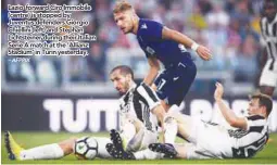  ?? – AFPPIX ?? Lazio forward Ciro Immobile (centre) is stopped by Juventus defenders Giorgio Chiellini (left) and Stephan Lichtstein­er during their Italian Serie A match at the ‘Allianz Stadium’ in Turin yesterday.