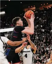  ?? Charles Krupa/Associated Press ?? UConn’s Donovan Clingan goes to the basket on Jan. 4 at Providence.