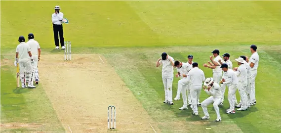  ??  ?? Long walk: Ireland celebrate as Jonny Bairstow heads to the pavilion after completing a pair