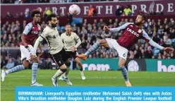  ?? ?? BIRMINGHAM: Liverpool’s Egyptian midfielder Mohamed Salah (left) vies with Aston Villa’s Brazilian midfielder Douglas Luiz during the English Premier League football match between Aston Villa and Liverpool on May 10, 2022. —AFP