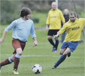  ??  ?? Wearmouth CW Old Boys (blue) look to create an opening against Pennywell Comrades last weekend.