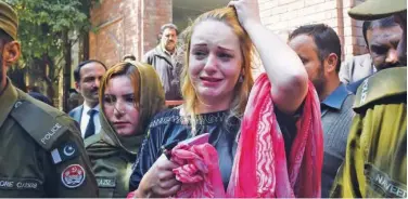  ?? Agence France-presse ?? ↑ Tereza Hluskova weeps after the court in Lahore on Wednesday.