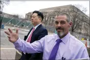  ?? ALEX BRANDON — THE ASSOCIATED PRESS ?? Kevin Seefried, right, a Delaware man who stormed the Capitol with a Confederat­e flag, departs a federal court in Washington on Thursday with his public defender, Eugene Ohm.