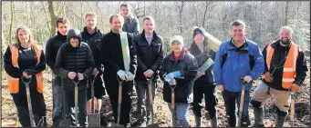  ??  ?? Coun Roy Rollings, lead member for transforma­tion, and Coun Jonathan Morgan, leader of Charnwood Borough Council, at a recent tree planting session with council officers, idverde rangers, students from Enstruct Training and volunteers from the Marios Tinenti Centre.