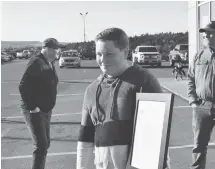  ?? BRENDAN AHERN/THE NEWS ?? Cole Ross holding a signed and framed letter sent to him by Nissan Canada president Steve Milette.