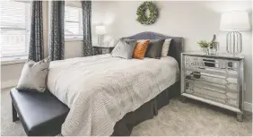  ??  ?? North Ridge’s Camden parade home at 310 Germain Manor features a spacious and relaxing master suite.