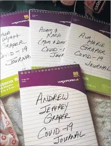  ?? KARA GRAPER ?? Kara Graper, of Crown Point, Ind. is giving her family COVID-19 journals. “Hopefully it will be the only one the kids will ever have to endure, and this will help them remember how they did.”