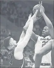  ?? BEN MARGOT — THE ASSOCIATED PRESS ?? Cal’s Kingsley Okoroh, right, shoots over Arizona’s Dusan Ristic during Wednesday night’s Pac-12 game at Haas Pavilion. The Bears lost 79-58, falling to 1-5 in conference.