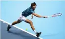  ?? Photograph: Julian Finney/Getty Images ?? Daniil Medvedev stretches to play a backhand against Stefanos Tsitsipas.