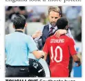  ??  ?? TOUGH LOVE Southgate hugs Sterling as he takes him off